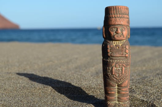Small statue in the sand photo