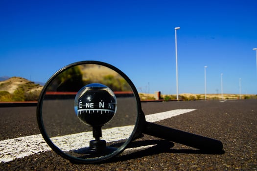 Magnifying glass on the road photo
