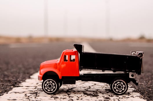 Toy truck on the road photo