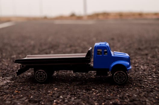 Toy truck on the road photo