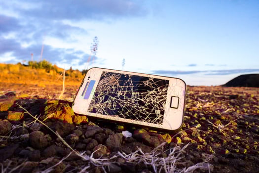 Broken phone on the ground photo