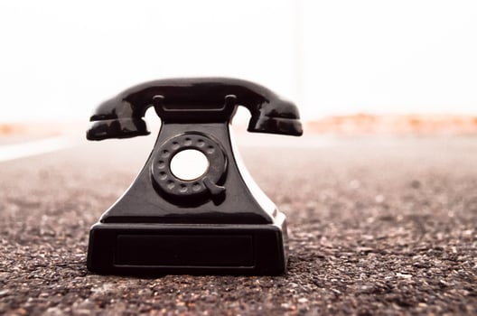 Old telephone on the road photo