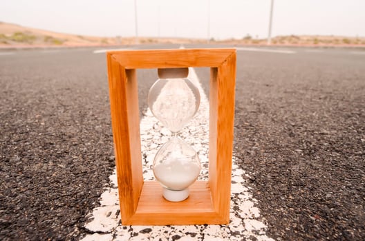 Hourglass on the road photo