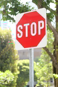 Stop sign in a empty road photo
