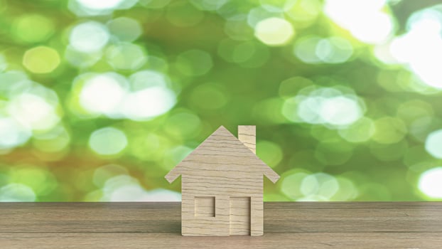 The wood home  on wood table for building content 3d rendering. photo