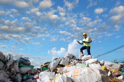 ecological engineering standing on the mountain rubbish big pile of garbage degraded waste A pile of bad smells and toxic residues. These wastes come from urban areas. industrial area photo