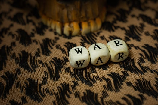 war on wood cube  on  shemagh  for  military content. photo