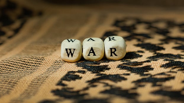 war on wood cube  on  shemagh  for  military content. photo