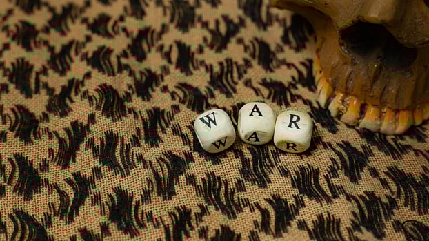 war on wood cube  on  shemagh  for  military content. photo
