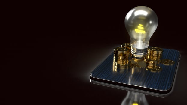 light bulb and gold coins on tablet for idea or business content 3d rendering. photo