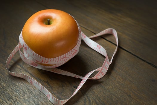 Apple and measuring tape image  for diet content. photo
