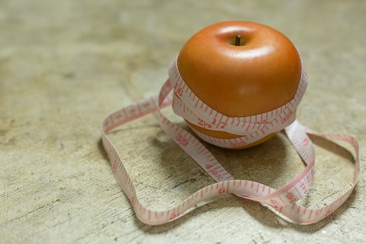 Apple and measuring tape image  for diet content. photo