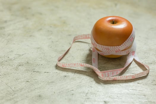 Apple and measuring tape image  for diet content. photo
