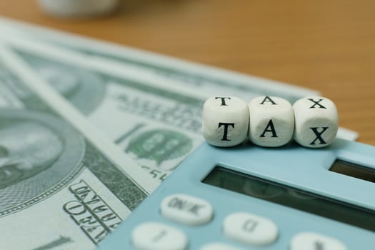 Tax wooden cubic on work table for business content. photo