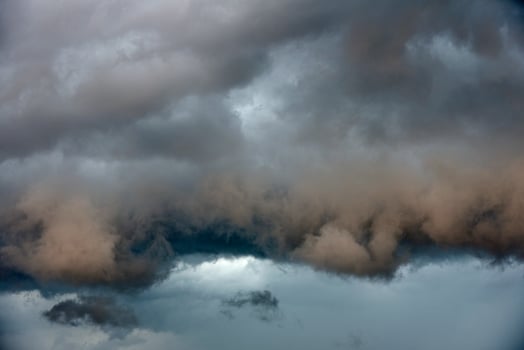 Black thunderstorm storm clouds on a summer day. Beautiful terrible thunderstorm. photo
