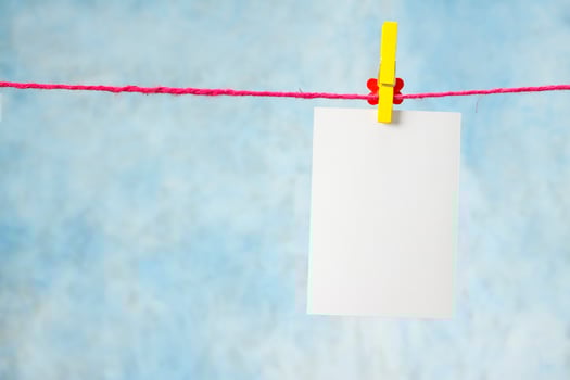 blank photo paper on blue background