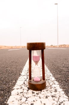 Hourglass on the ground photo