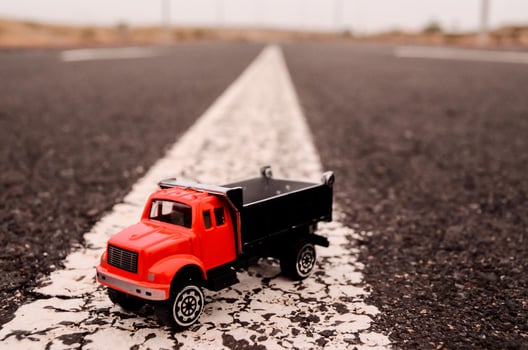 Toy truck on the road photo