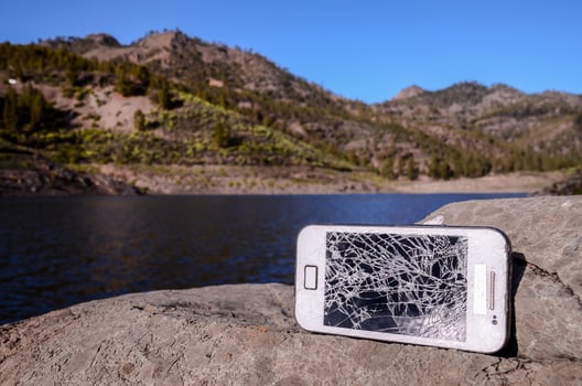 Broken phone on the rocks photo