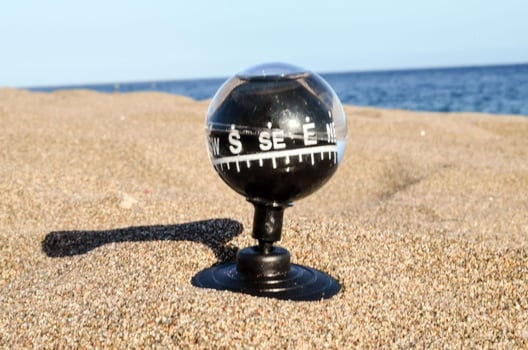 Compass in the sand photo