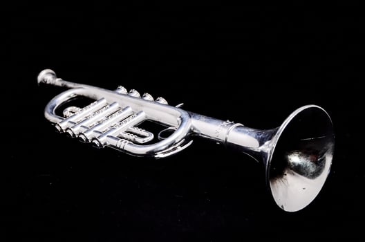 Trumpet on black background photo