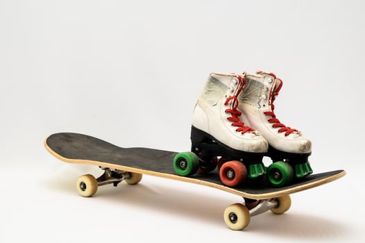 Skateboard and roller skates photo