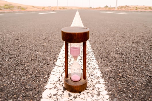 Hourglass on the road photo