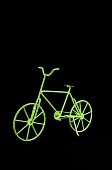 Green toy bicycle photo