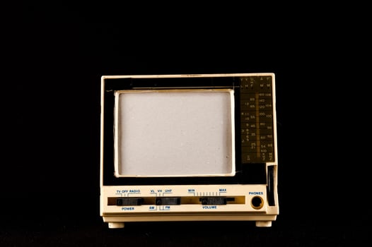 Old television on black background photo
