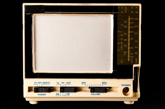 Old television on black background photo