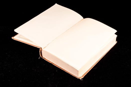 Book on black background photo
