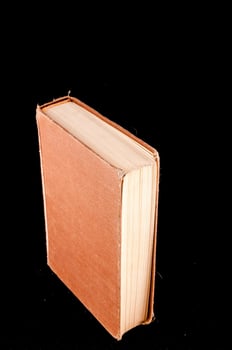 Book on black background photo