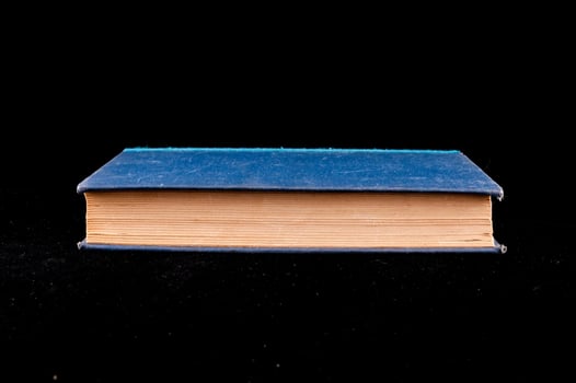 Book on black background photo
