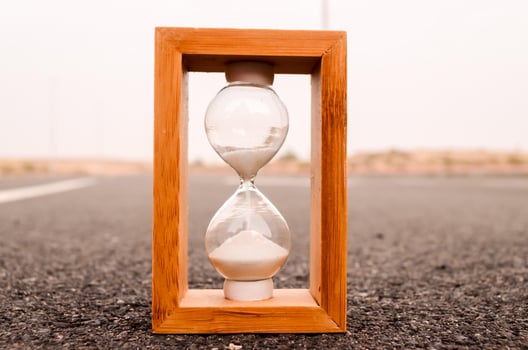 Hourglass on the ground photo
