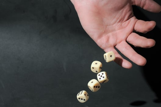 Hand throwing dice photo