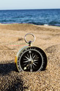 Compass on the sand photo