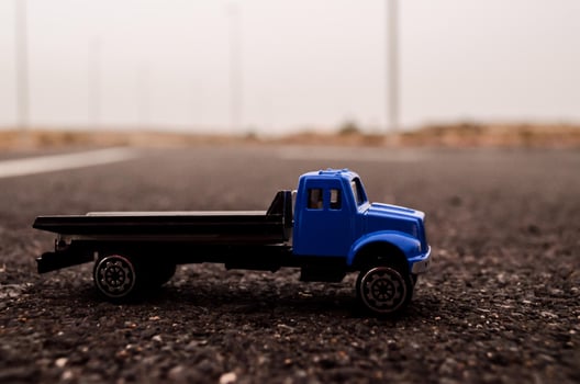 Toy truck on the road photo