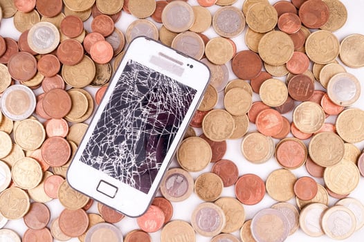 Broken phone on coins photo