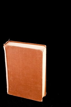 Book on black background photo