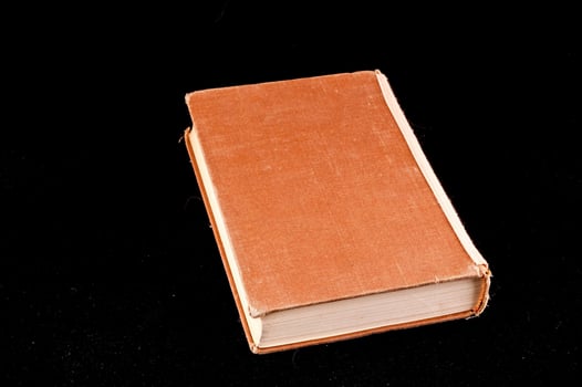 Book on black background photo