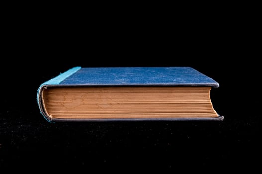 Book on black background photo