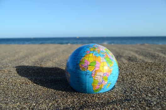 Globe in the sand photo