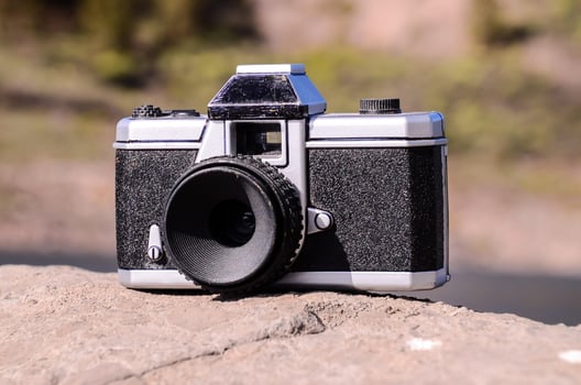VIntage camera on a rock photo