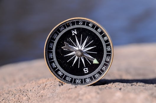 Compass on a rock photo