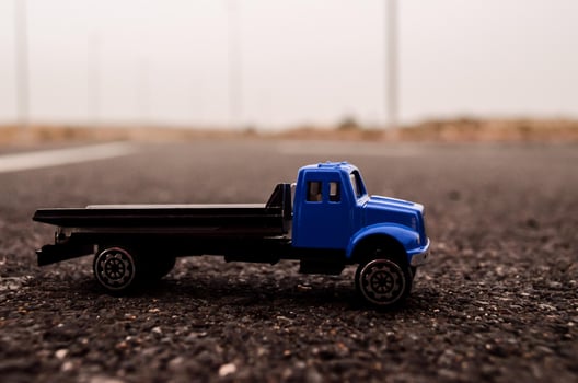 Toy truck on the road photo