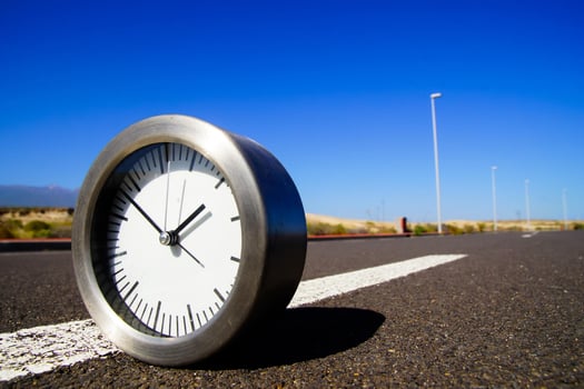 Clock on the road photo