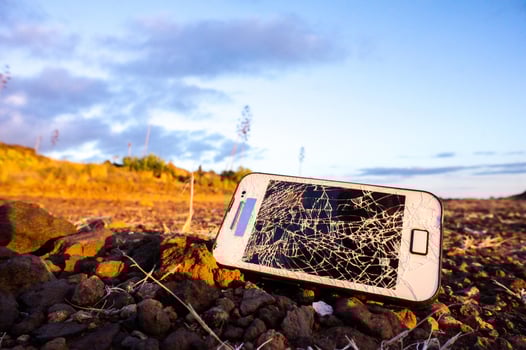 Broken phone on the ground photo