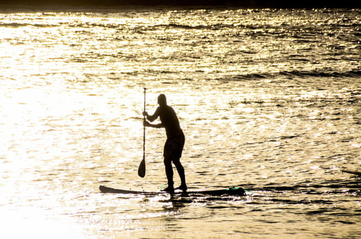 Surfing in the ocean photo