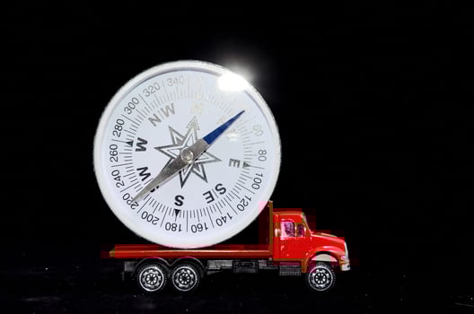 Toy car and compass photo