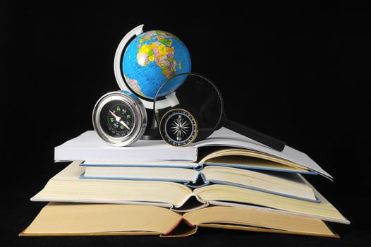 Books, compasses and earth globe photo